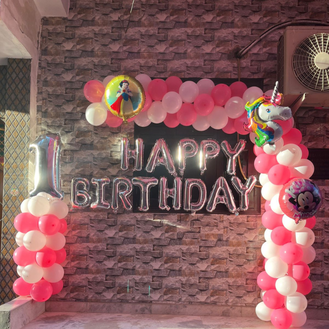 Birthday balloon decoration at home in Delhi with red and white theme